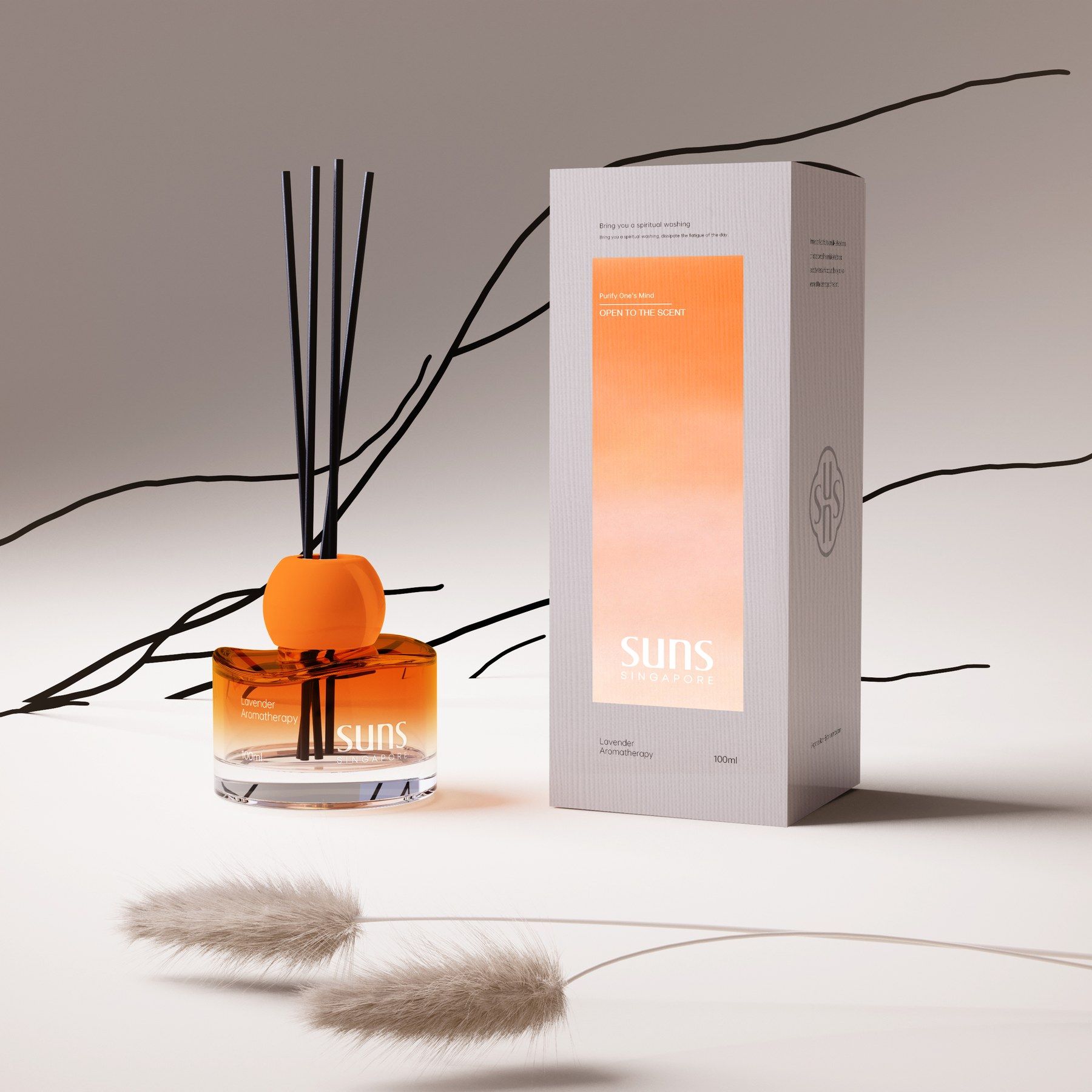 Sunset reed diffuser with an orange cap beside its box